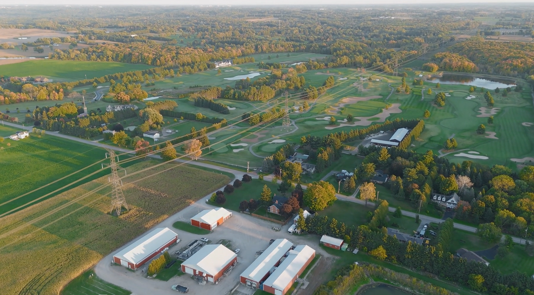 The Copetown Woods family farm and golf course seen together from the air