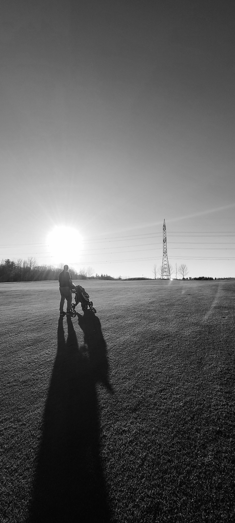 A golfer walking the course at Copetown Woods